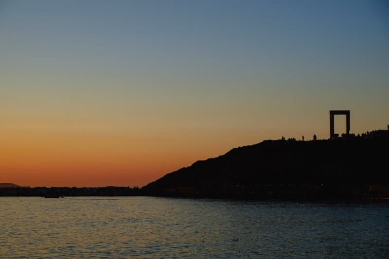 View of Portara on the islet of Palatia at sunset