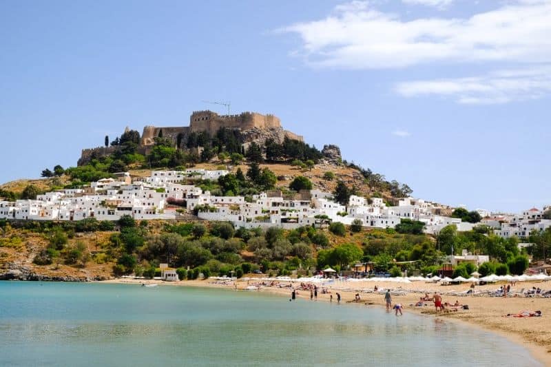 Lindos beach with village and acropolis