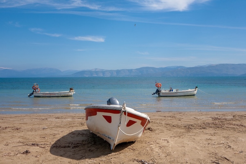 Small fishing boards on Kavos' sandy beach.
