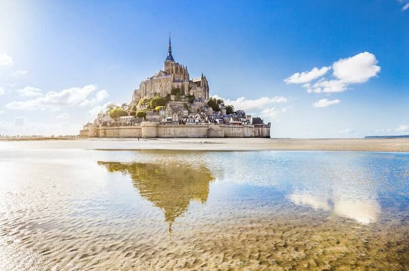 Mont St Michel and reflection in low tide sea
