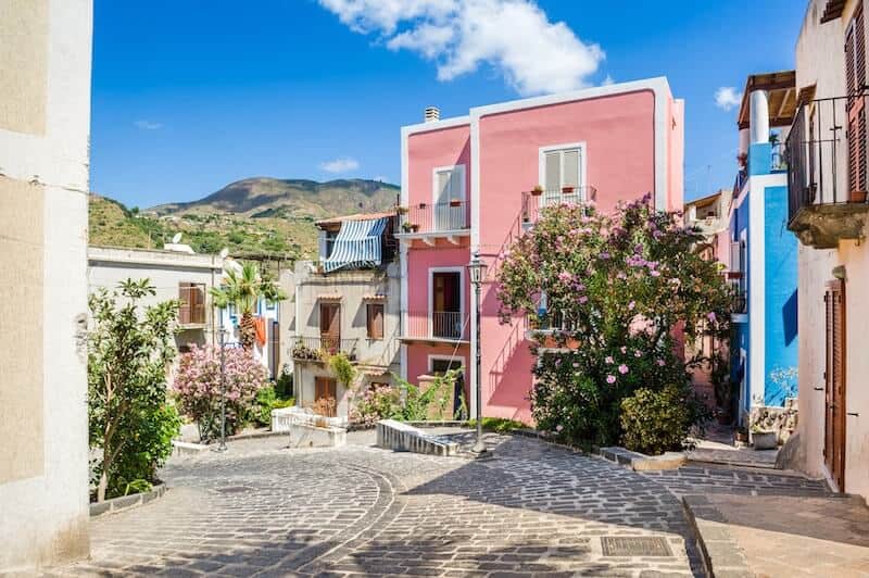 Pink house and flowers on a Lipari street