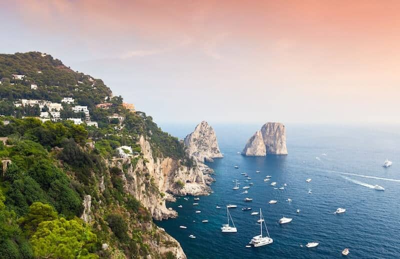 boats surrounding Capri's iconic cliffs