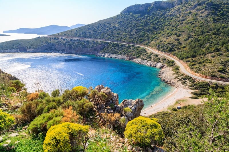 a small sandy beach in the hilly and green Datca Peninsula