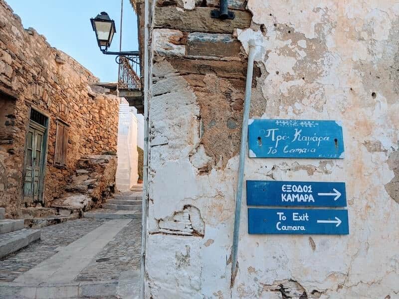 Signposts in an alleyway, Ano Syros.