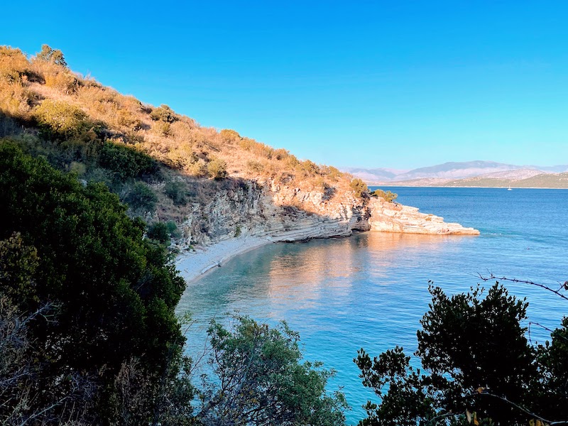 An empty forested cove as the sun goes down.