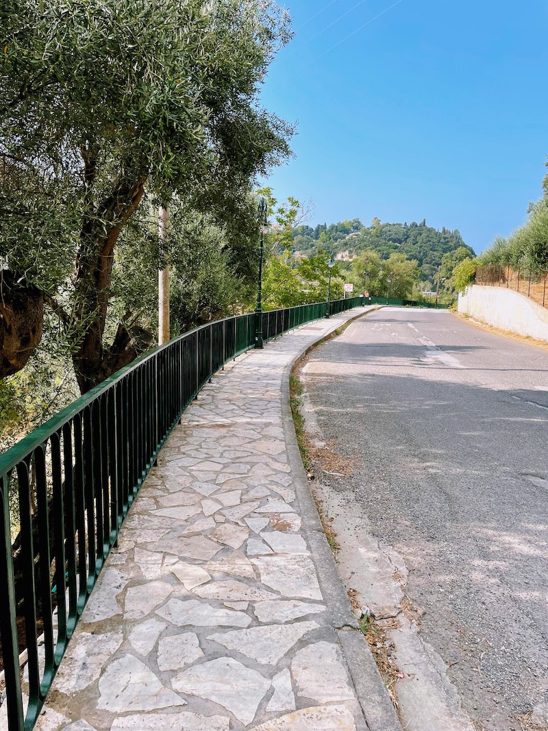 Sidewalk along the main road in Paleokastritsa.