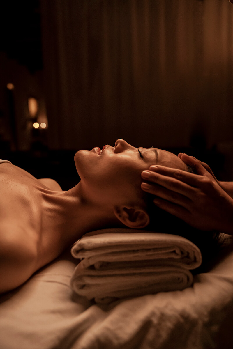 Woman having a massage at AIRE.