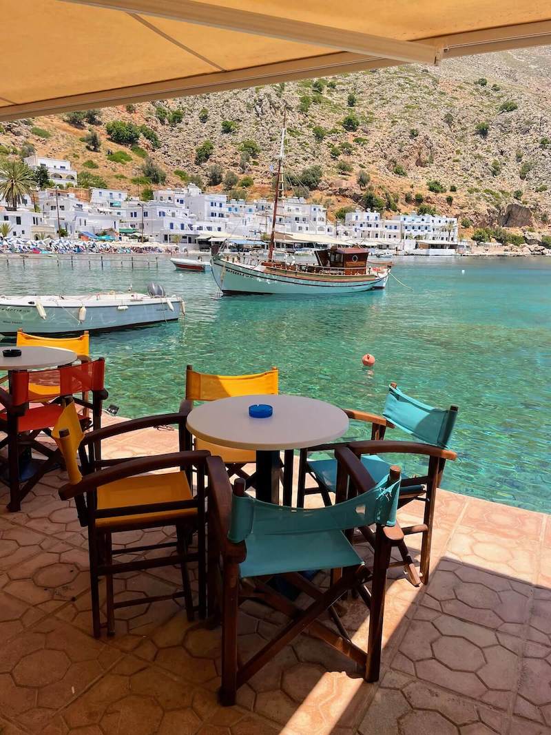 Taverna table right by the water in Loutro.