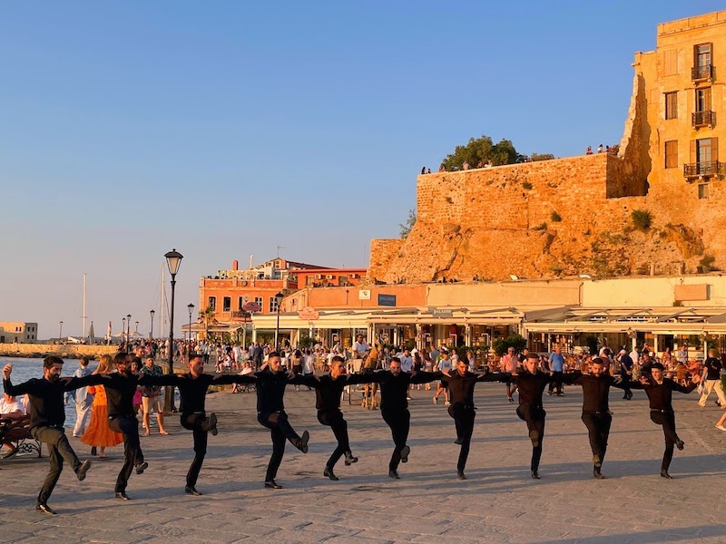 Traditional dancers as the sun goes down in Chania.