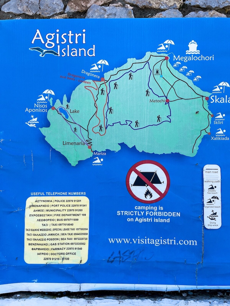 A board with a hand-drawn map of the walking trials on Agistri.