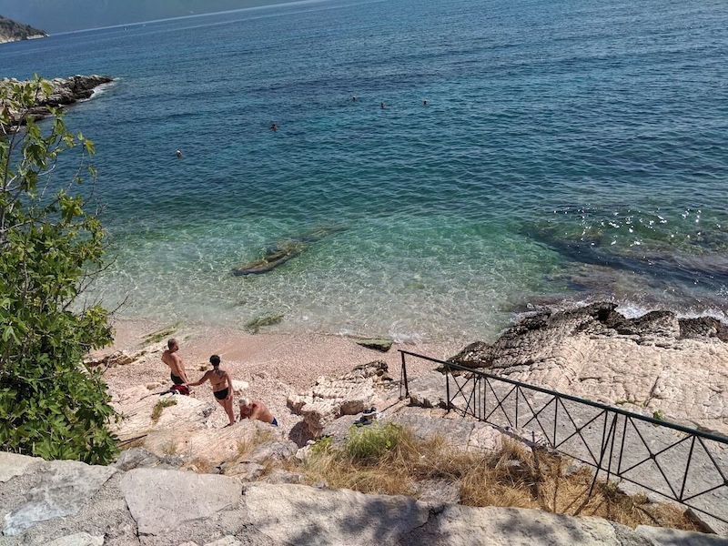 Bathers down at tiny Elies beach.
